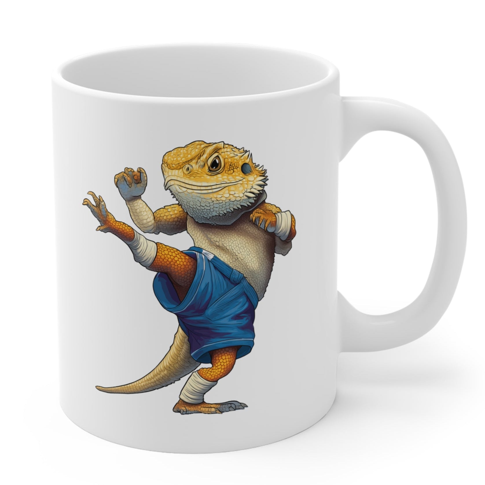 White mug with a bearded dragon illustration wearing blue Muay Thai shorts on a white background